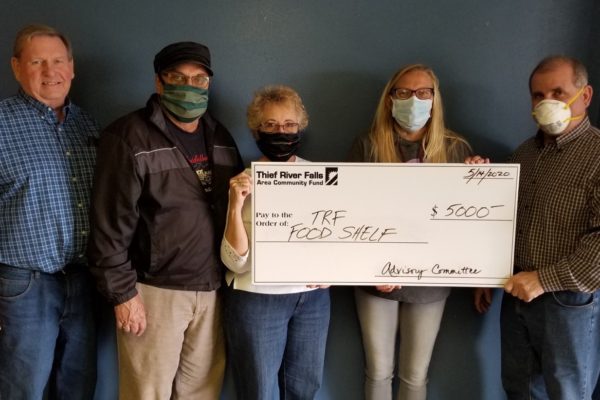 (From L-R) Ole Tweet (TRFACF), Jim Strandlie (TRFACF), Jan Strandlie (TRFACF), Alecia Hunt (TRF Food Shelf), and Dennis Bona (TRFACF).